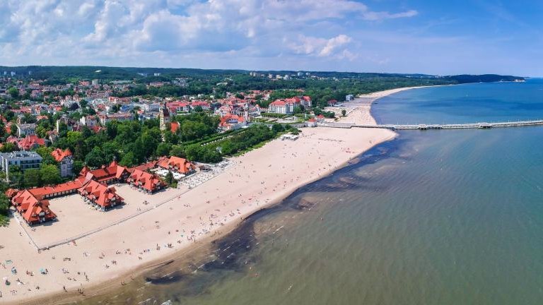 shutterstock_1431976778 Panorama of the Baltic sea coastline with wooden pier in Sopot, Poland.jpg