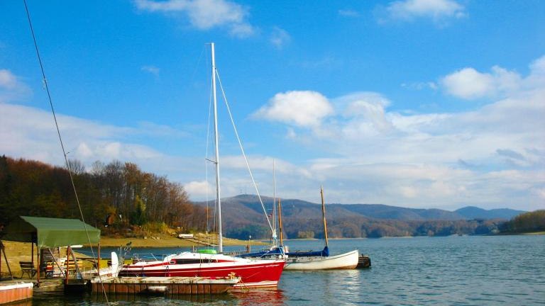 shutterstock_1571957383 Lake in Poland - solina lake. Lake in autumn or fall. Boat on a lake shore.jpg