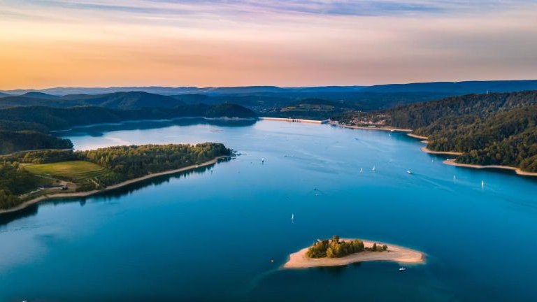 shutterstock_2162510555 Dam and island on Solina Lake at sunset.jpg